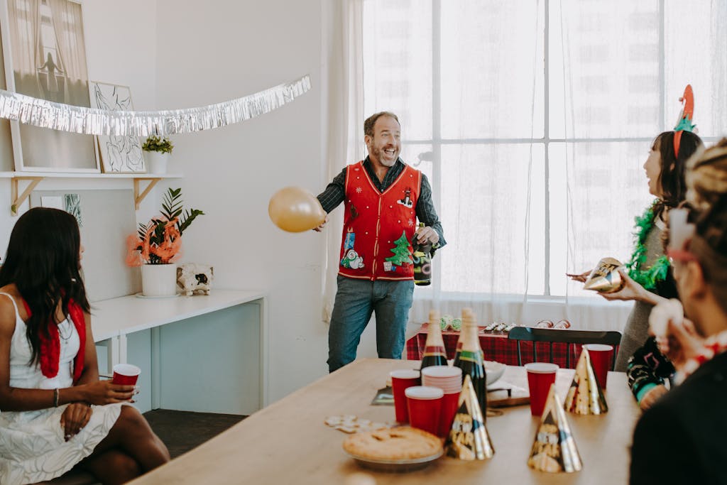 A lively office Christmas party with festive decorations and joyful interactions.